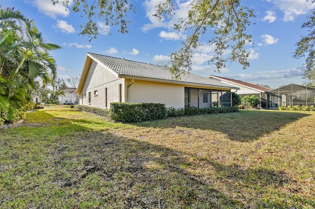 rear view of property with a yard