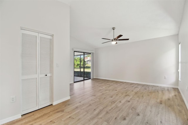 interior space with vaulted ceiling, ceiling fan, and light wood-type flooring