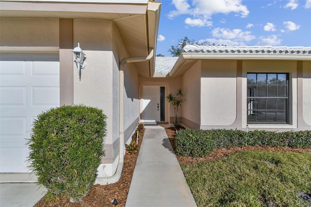 entrance to property featuring a garage