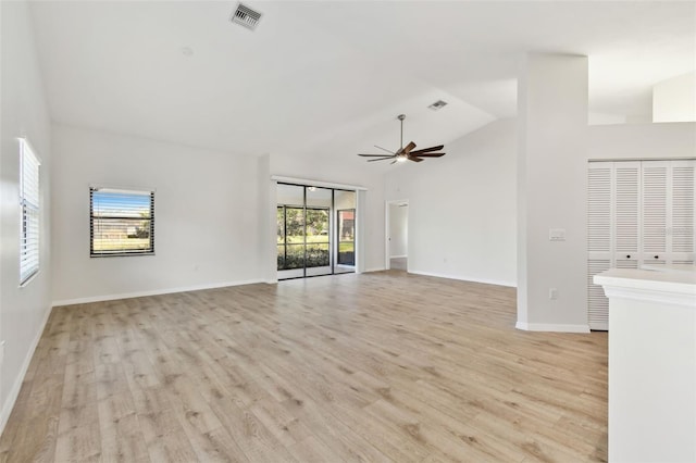 unfurnished living room with lofted ceiling, light hardwood / wood-style floors, and ceiling fan