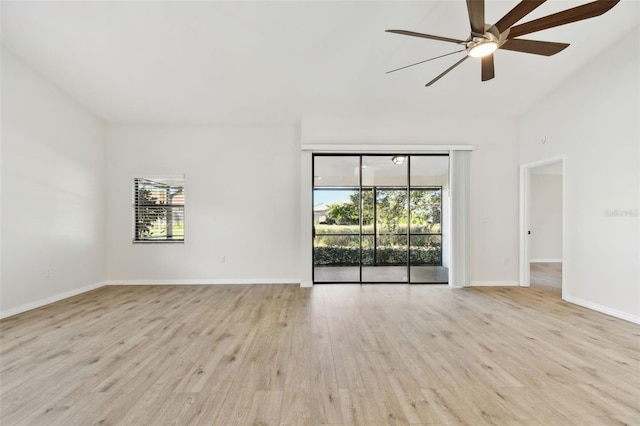 spare room with ceiling fan and light wood-type flooring