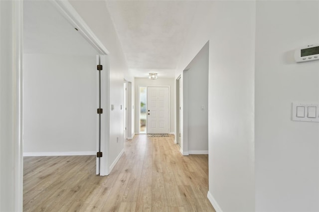 hall with light wood-type flooring