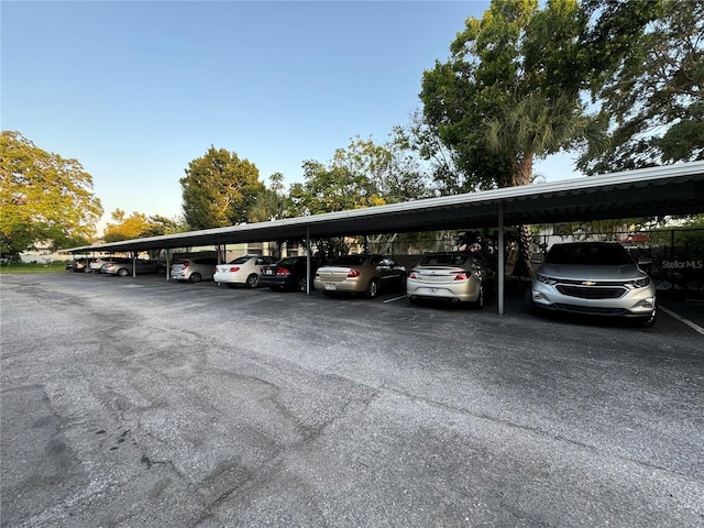 view of vehicle parking featuring a carport