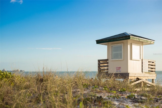 view of outbuilding featuring a water view