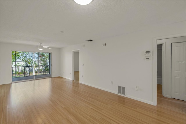 3987 Maceachen Blvd Unit 133, Sarasota, FL 34233 - empty room with light wood-style floors, a ceiling fan, and visible vents