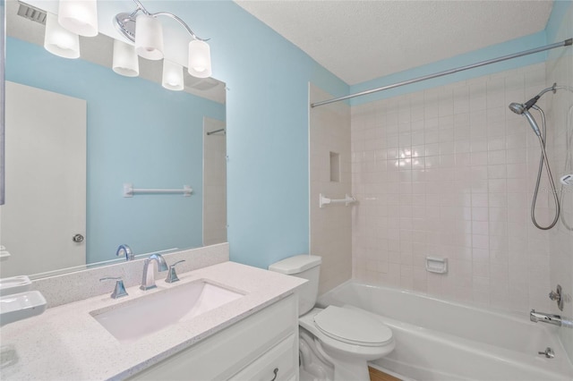 3987 Maceachen Blvd Unit 133, Sarasota, FL 34233 - bathroom with vanity, washtub / shower combination, visible vents, and toilet