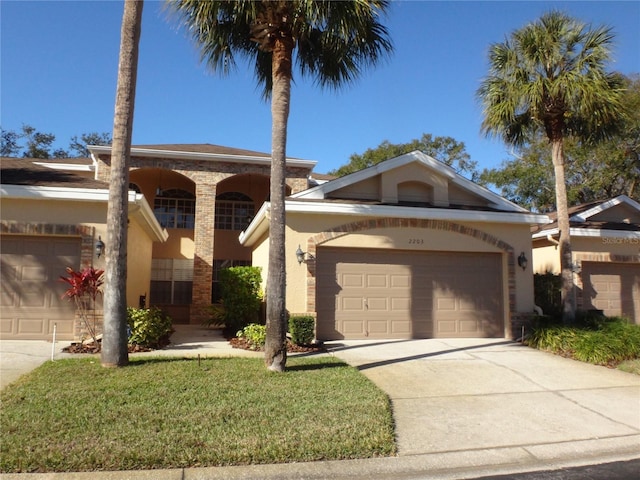 view of front of home featuring a front yard and a garage