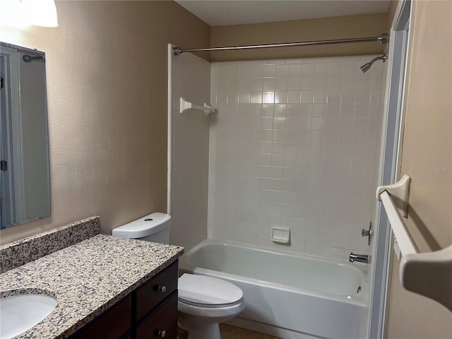 full bathroom with vanity, toilet, and tiled shower / bath