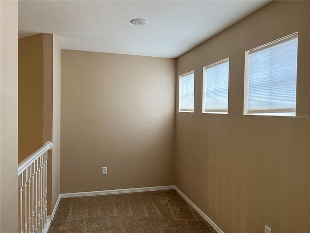 spare room featuring carpet flooring