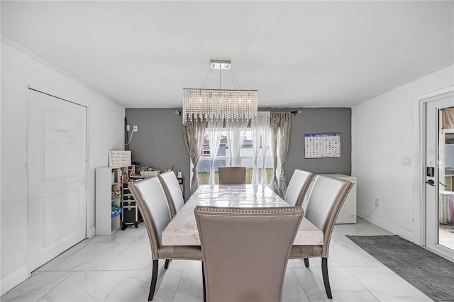 dining room with a notable chandelier