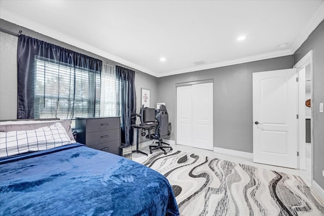 bedroom with crown molding and a closet