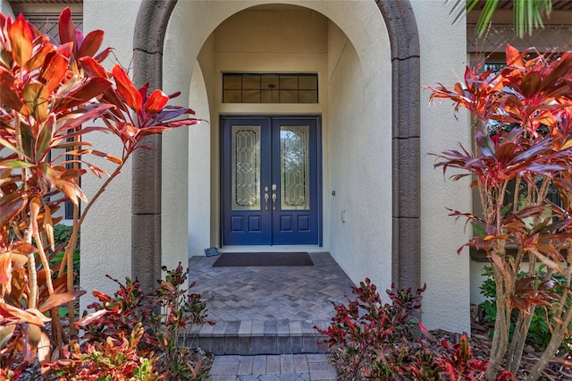 property entrance featuring french doors