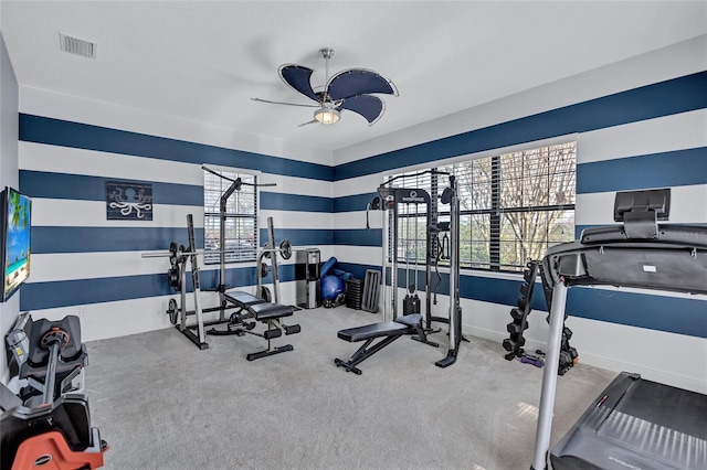 workout room with carpet flooring and ceiling fan