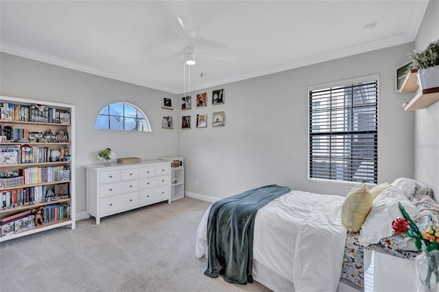 bedroom with light carpet, ceiling fan, and crown molding