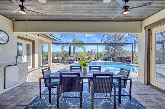 sunroom featuring french doors, ceiling fan, and wooden ceiling