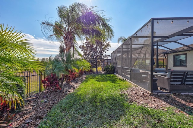 view of yard featuring glass enclosure