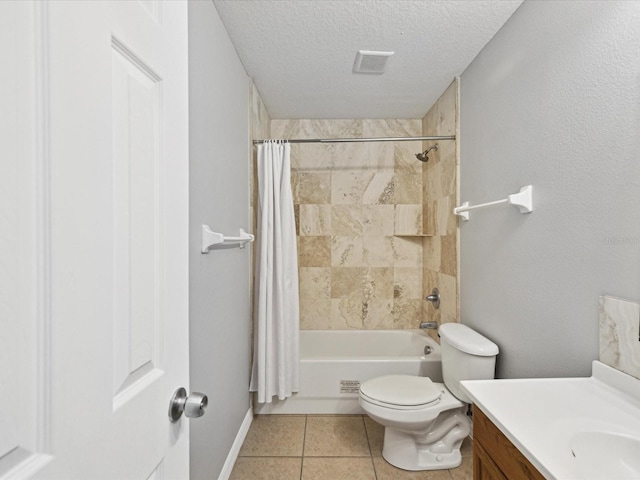 full bathroom featuring toilet, vanity, tile patterned floors, shower / bath combination with curtain, and a textured ceiling