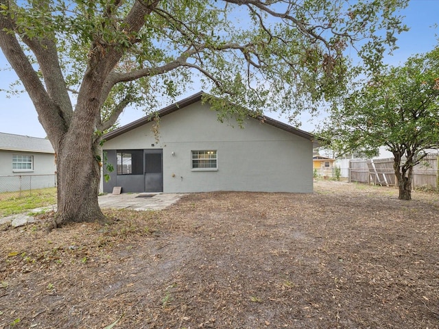 back of property featuring a patio