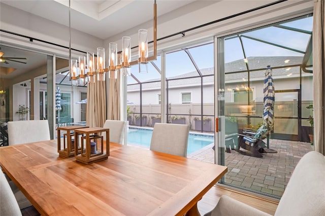 dining room with ceiling fan and hardwood / wood-style floors