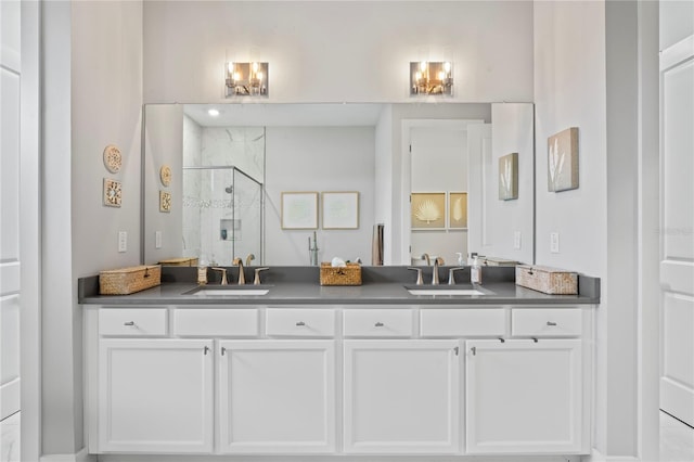 bathroom featuring vanity and an enclosed shower