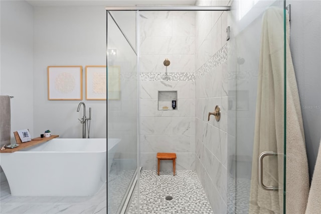 bathroom with separate shower and tub