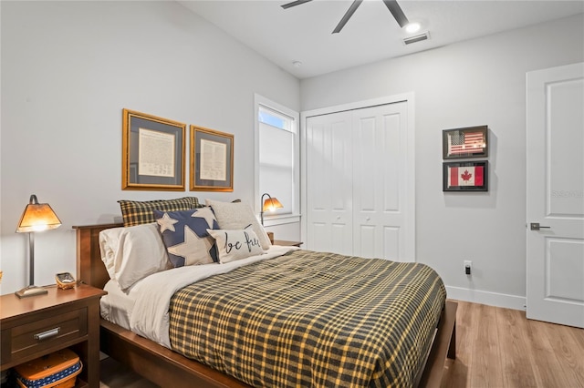 bedroom featuring light wood-type flooring, ceiling fan, and a closet