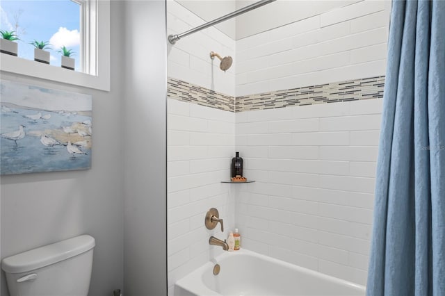 bathroom with toilet and shower / bath combo with shower curtain