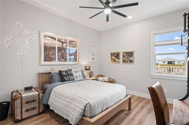 bedroom featuring hardwood / wood-style flooring and ceiling fan