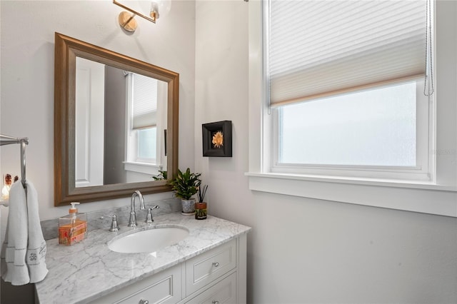 bathroom featuring vanity and a wealth of natural light