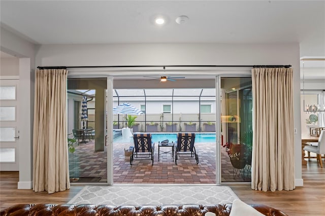 entryway with wood-type flooring and ceiling fan