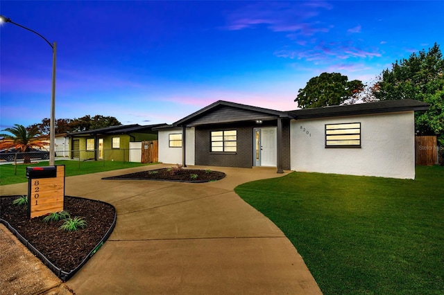 view of front of house with a yard