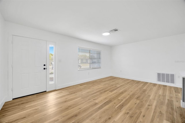 foyer entrance with light wood-type flooring