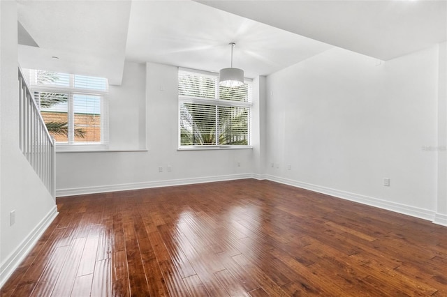 interior space with dark hardwood / wood-style floors and plenty of natural light