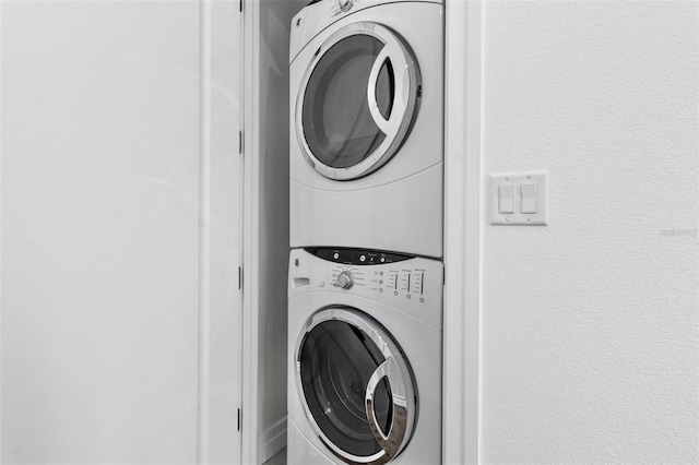 laundry area with stacked washer / drying machine