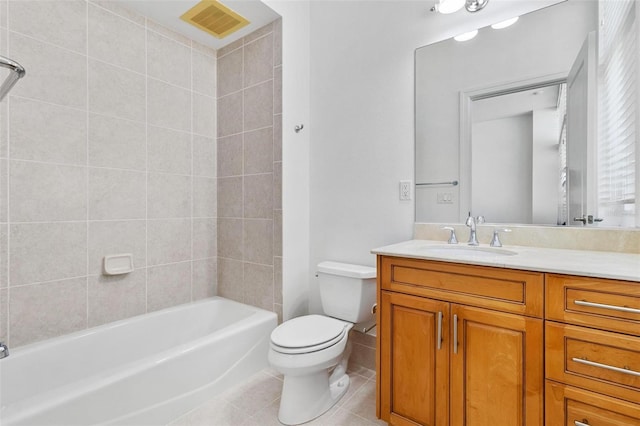 full bathroom with tile patterned floors, vanity, toilet, and tiled shower / bath