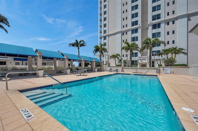 view of swimming pool featuring a patio