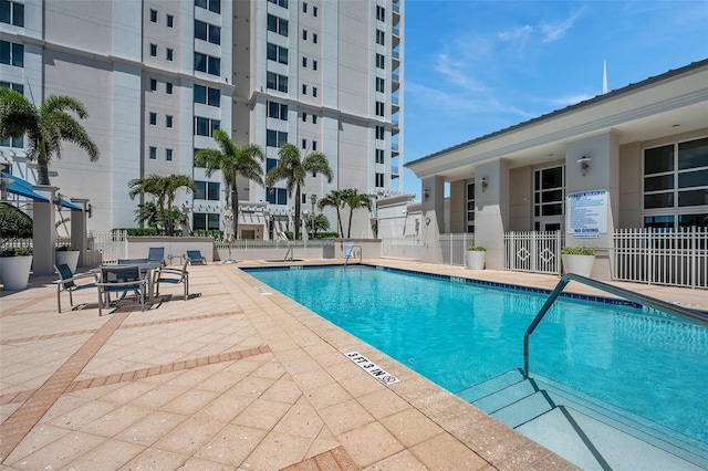 view of swimming pool with a patio