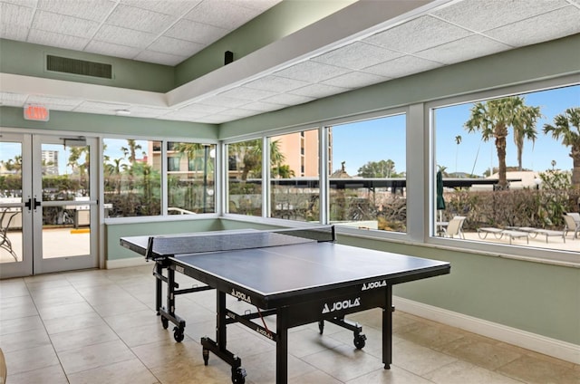 playroom with french doors and a drop ceiling