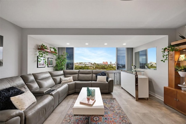 31 Island Way Unit 303, Clearwater Beach, FL 33767 - living room featuring light tile patterned floors, baseboards, and recessed lighting