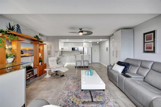 31 Island Way Unit 303, Clearwater Beach, FL 33767 - living area with a ceiling fan and light tile patterned flooring