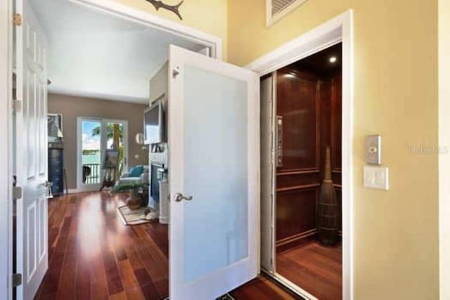 hall featuring dark wood-type flooring