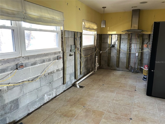 basement with black refrigerator