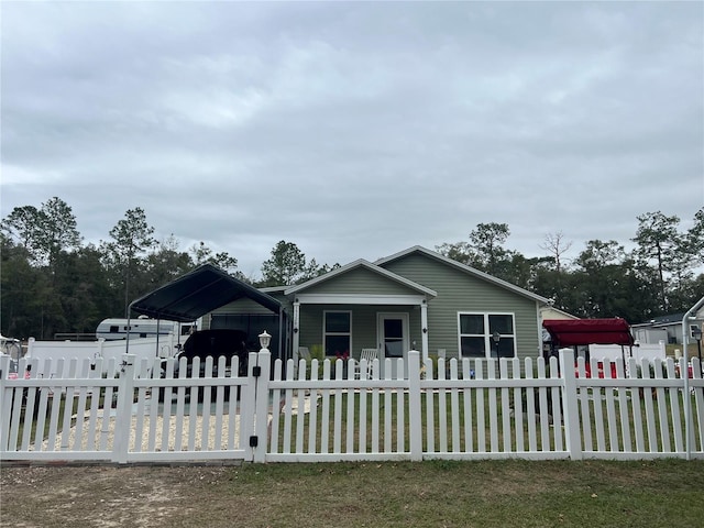 view of front of property featuring a carport