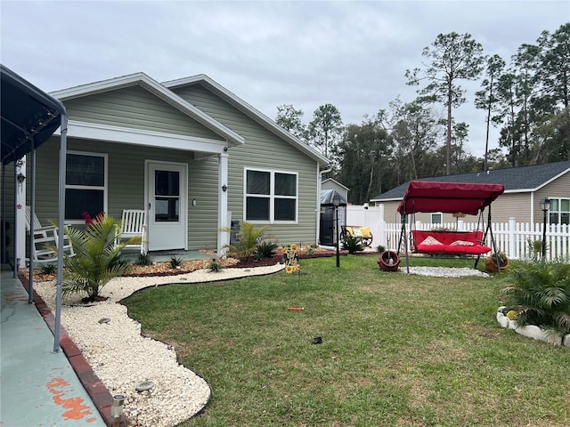 view of front facade with a front yard and a porch