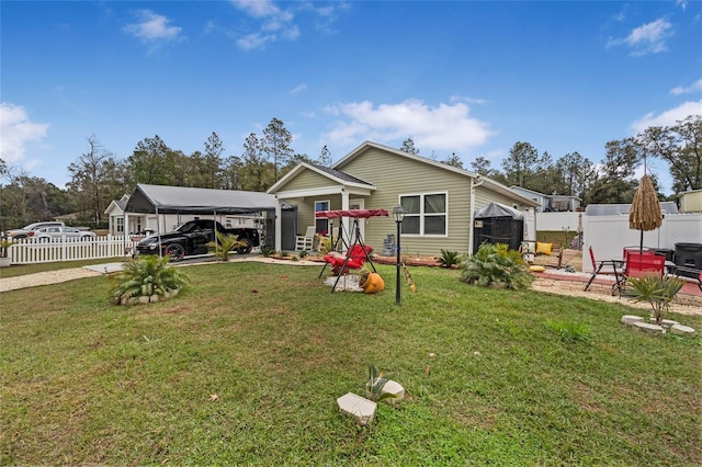 view of front of property featuring a carport and a front yard