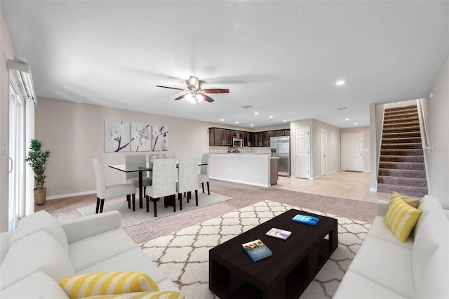 tiled living room with ceiling fan