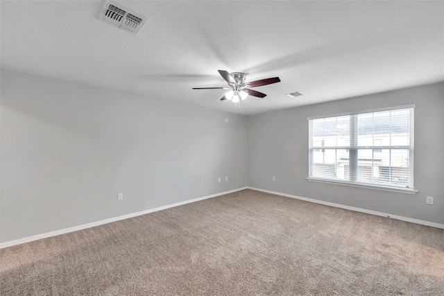 unfurnished room featuring ceiling fan and carpet flooring