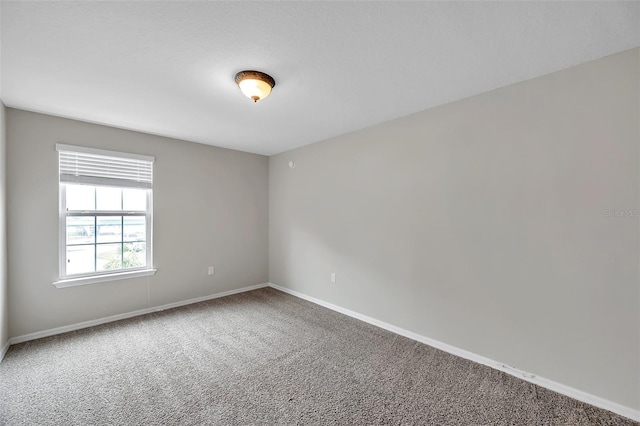 unfurnished room featuring carpet floors