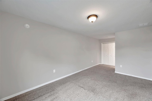 empty room with carpet flooring