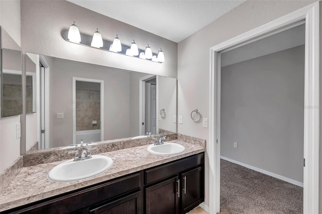 bathroom with vanity and a textured ceiling